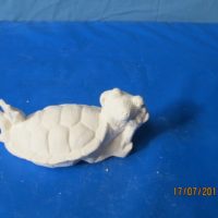 nowells 3243 attitude turtle on tummy (FR 122)  bisqueware