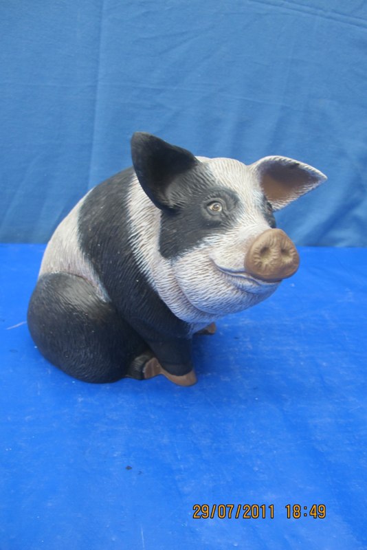 arnels 1226 hairy pig sitting (wirehair) (PIG 39)  8.25"H,10"L  bisqueware