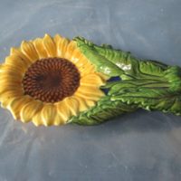 duncan 1880 sunflower spoon rest  1.38"H,8.25"L,4.5"W  bisqueware