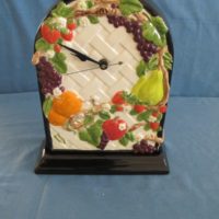 duncan 1806/1497 fruit lattice wall clock or on base (CL 9)  10"H,  bisqueware