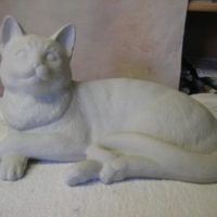 duncan 1859/1860 lge reclining cat (CT40)  12.1/2"W head 5.1/2"H  bisqueware